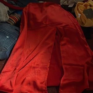 Red floor length slit skirt.